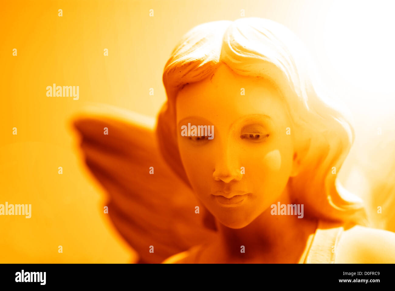 Angel statue with wings representing purity and heavenly strength Stock