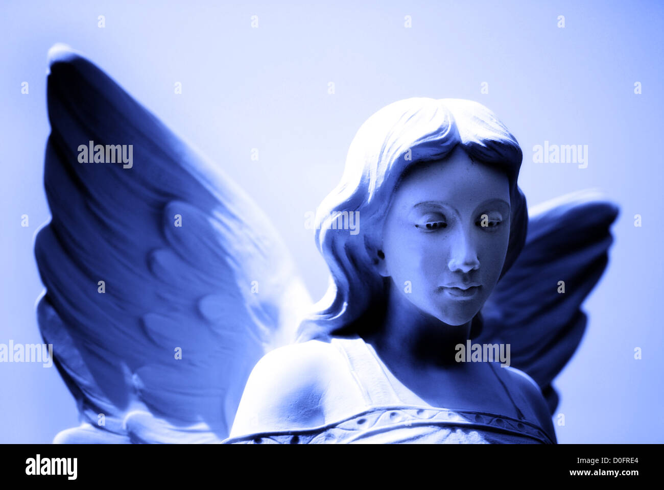 Angel statue with wings representing purity and heavenly strength Stock Photo