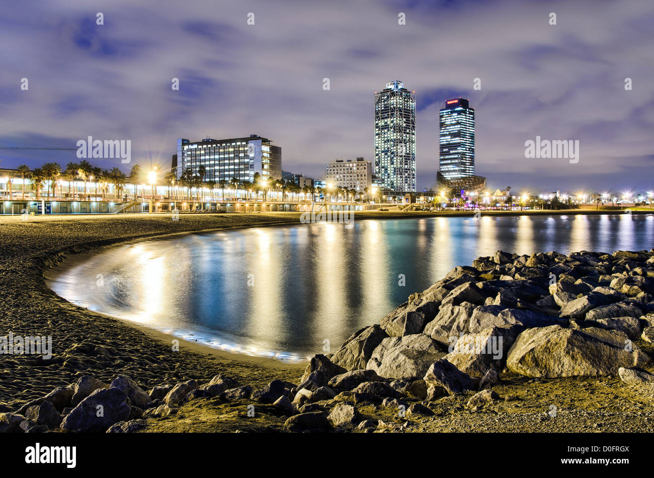 Coastline of Barcelona at night with a view of hotel towers, Spain Stock Photo