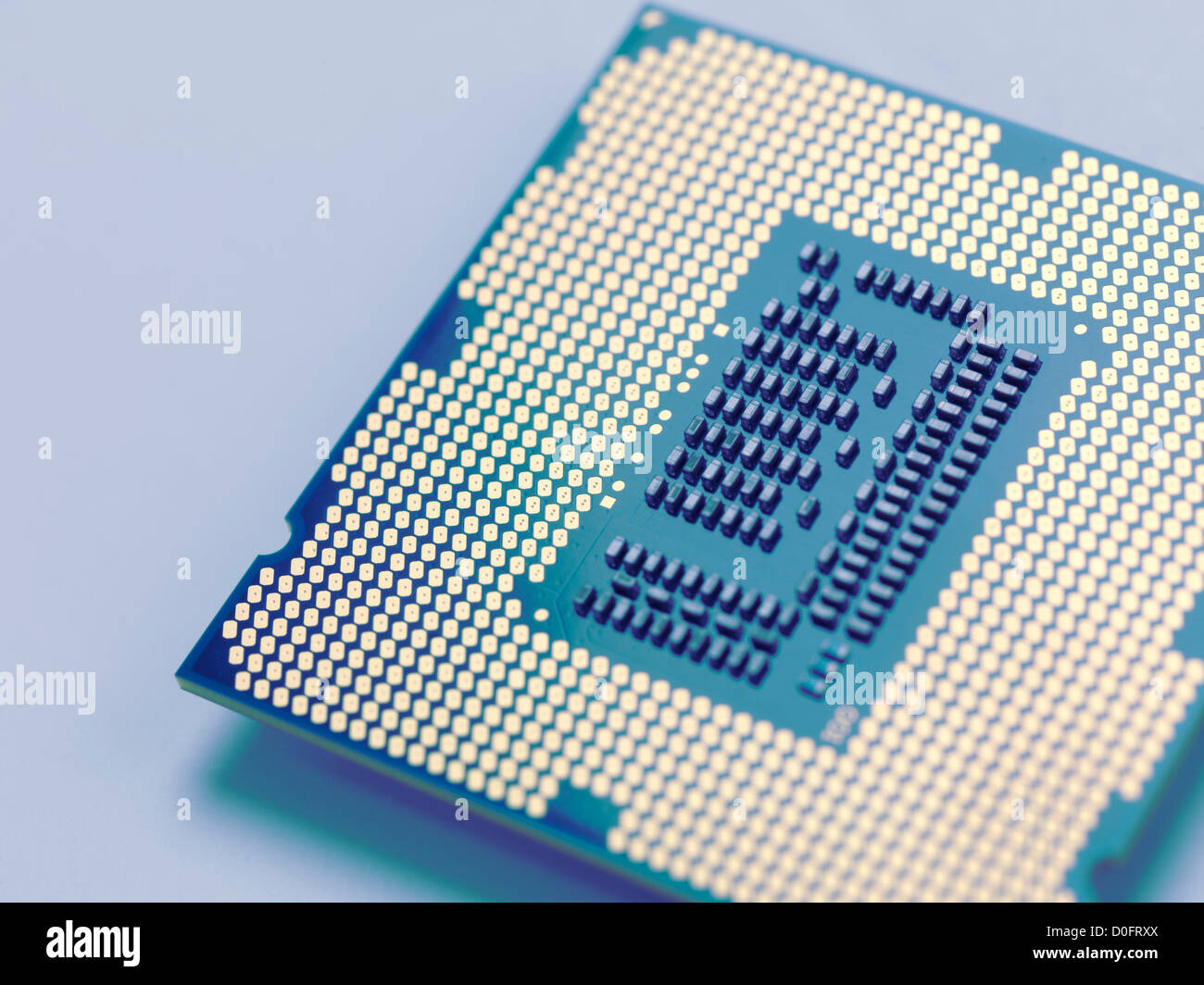 Closeup of Intel i7 3770K processor with LGA 1155 CPU socket isolated on  blue background Stock Photo - Alamy