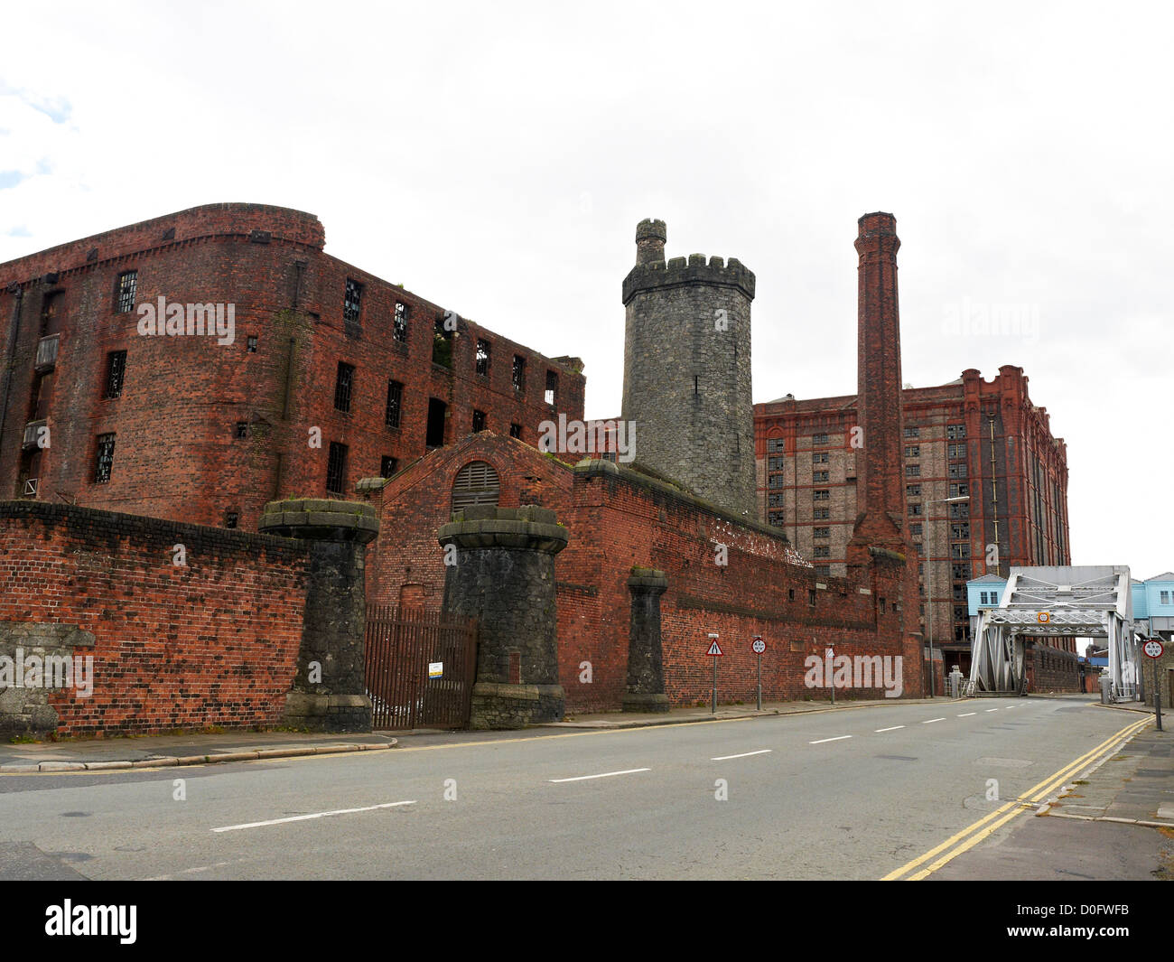 Bascule bridge with Tobacco warehouse and Stanley Dock on Dock Road in Liverpool UK Stock Photo