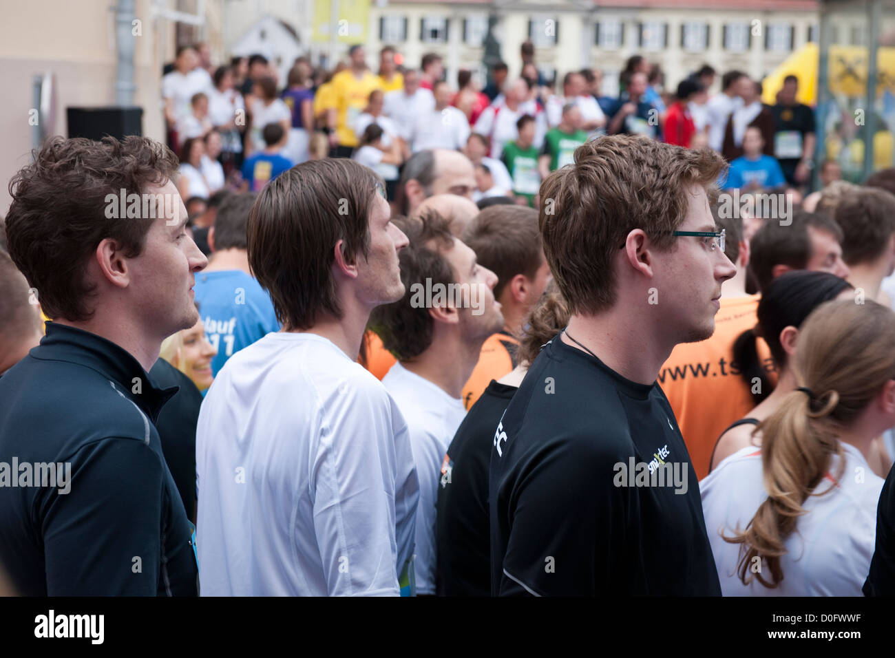 Competitors mill about at the start of a fun run in Graz, Austria Stock Photo