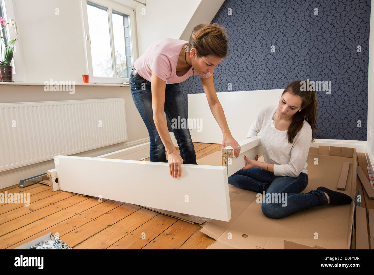 Mother And Daughter Assemble Furniture Bed Do It Yourself Home Stock Photo Alamy