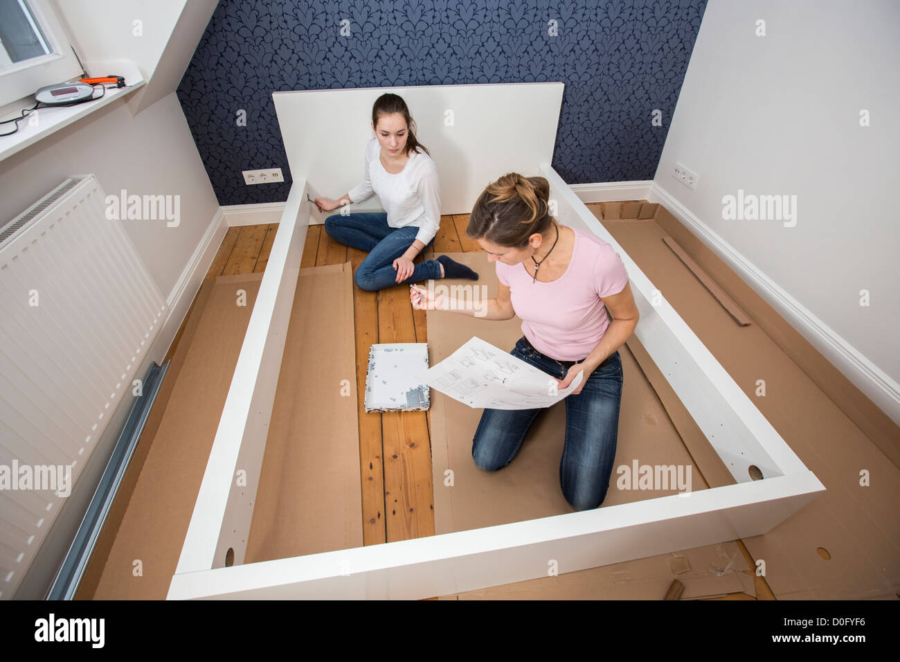 Mother And Daughter Assemble Furniture Bed Do It Yourself Home Stock Photo Alamy