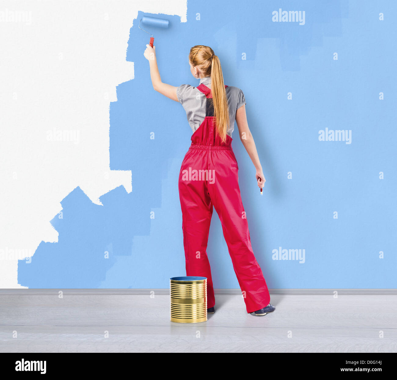 Woman in overalls painting wall hi-res stock photography and images - Alamy