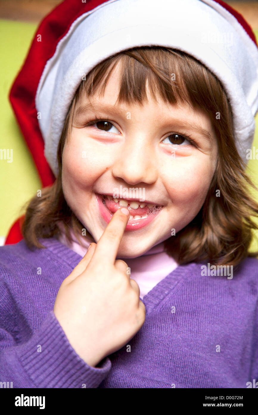 Four year old boy smiling , wearing Christmas hat Stock Photo Alamy