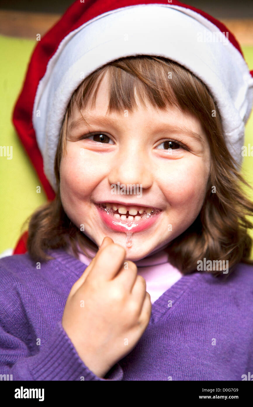 Four year old boy smiling , wearing Christmas hat Stock Photo Alamy