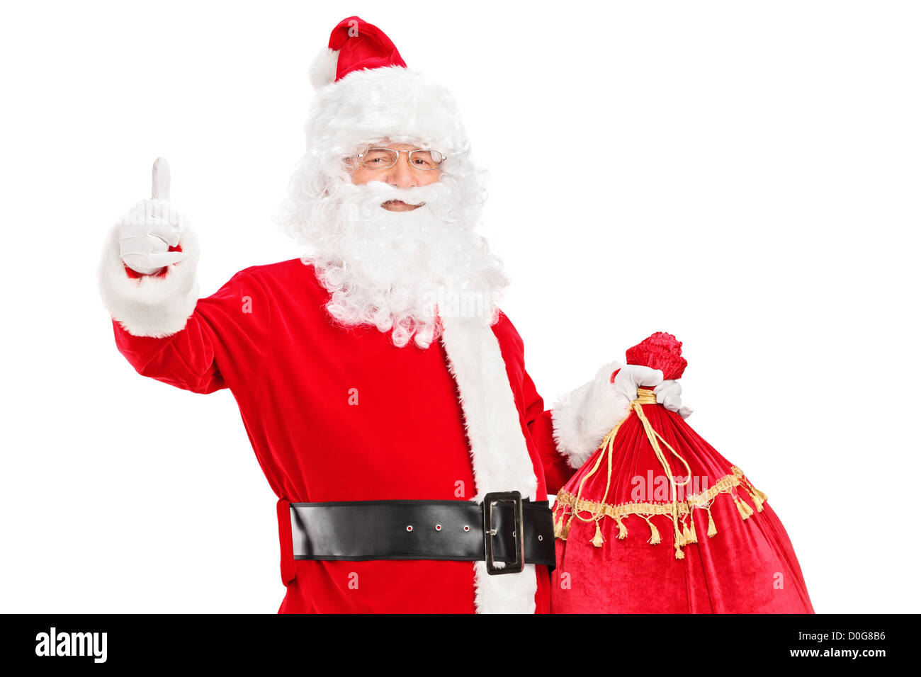 A Santa Claus holding a bag full of gifts and giving a thumb up ...
