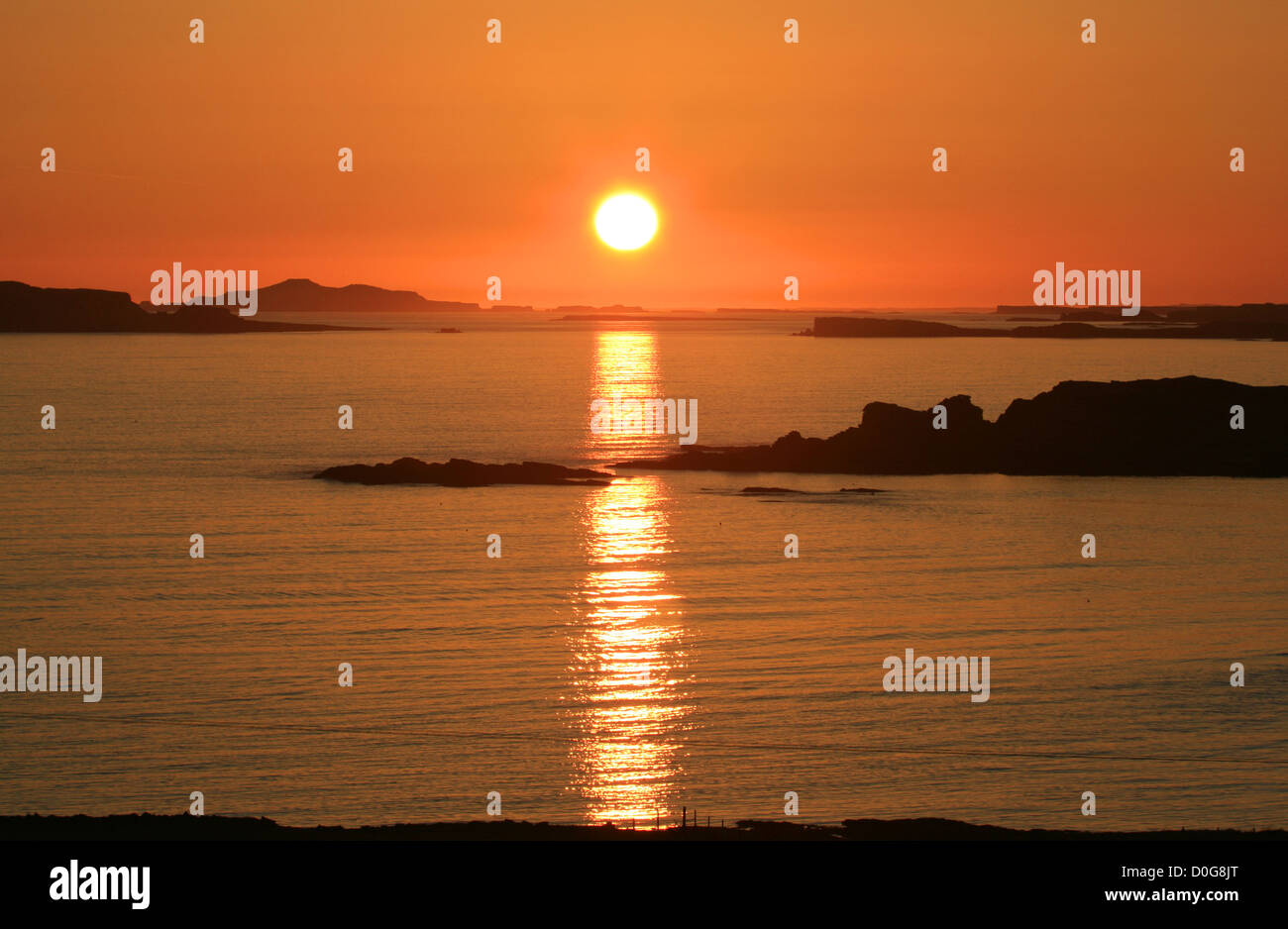 UK Scotland Strathclyde Sun Setting over the Treshnish islands from Mull Stock Photo