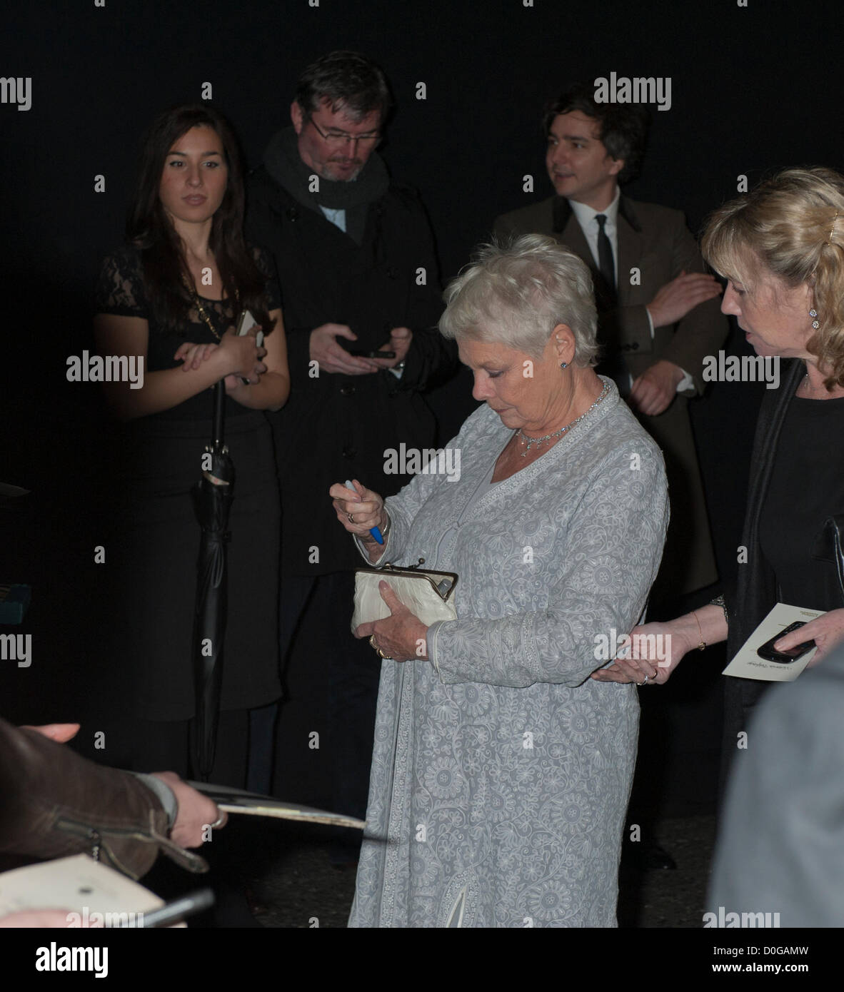Dame Judi Dench searches for pen at Evening Standard Theatre Awards 2012, The Savoy, London 25th November 2012 Brish actor Played M in The recent James Bond films Stock Photo