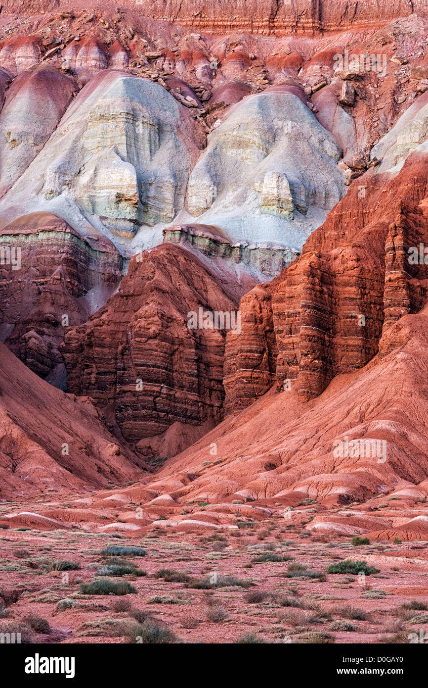 Multi-hued rock layers make up the sandstone walls of Utah’s Capitol Reef National Park. Stock Photo