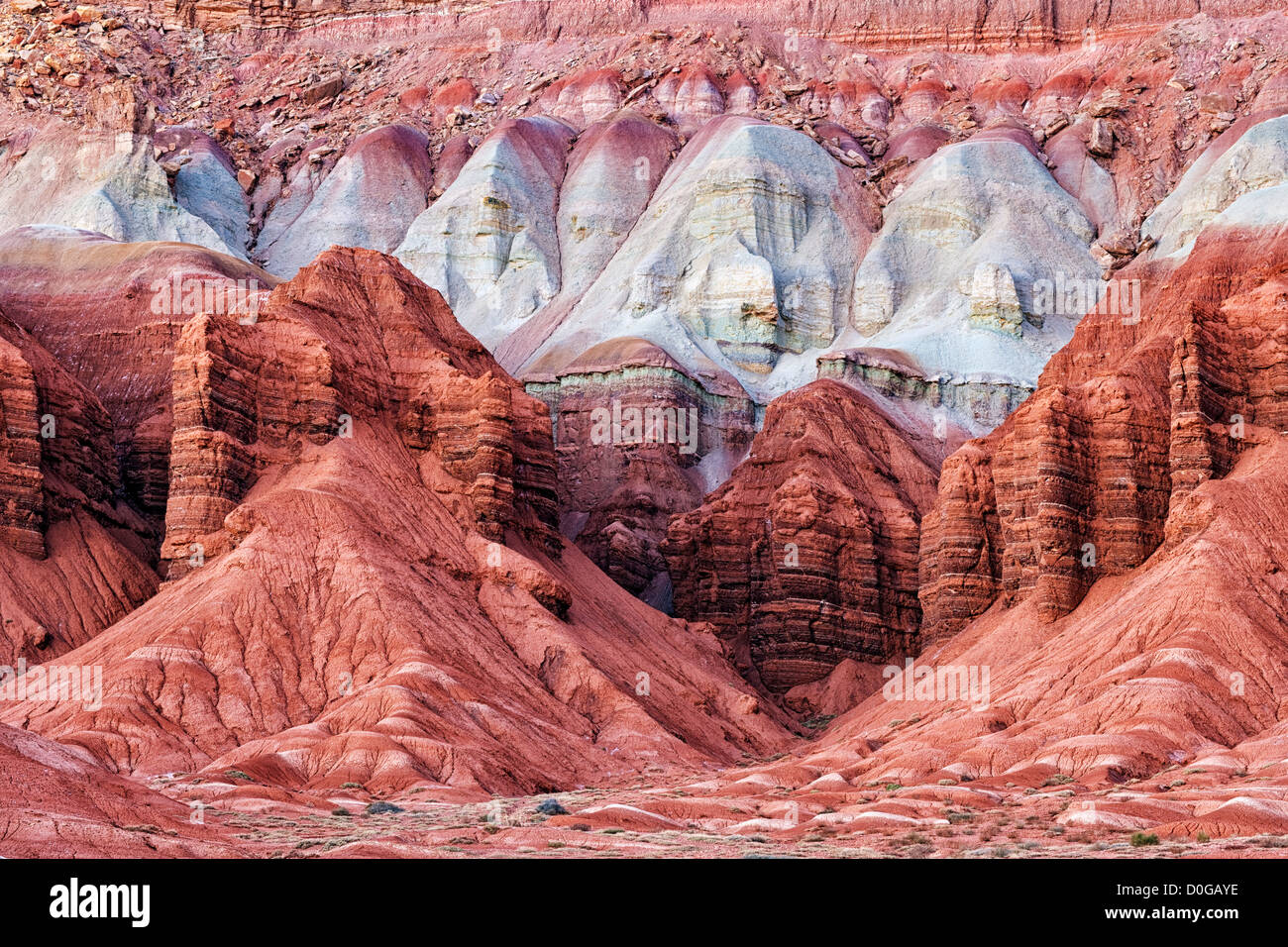 Multi-hued rock layers make up the sandstone walls of Utah’s Capitol Reef National Park. Stock Photo