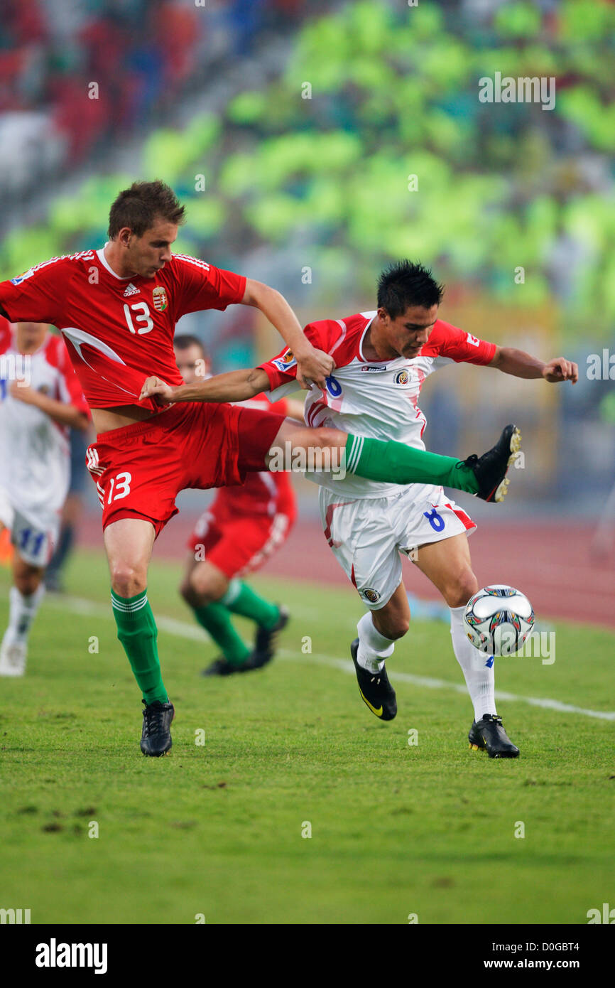 Adrian Szekeres of Hungary (13) defends against David Guzman of Costa Rica (8) during the 2009 FIFA U-20 World Cup third place. Stock Photo