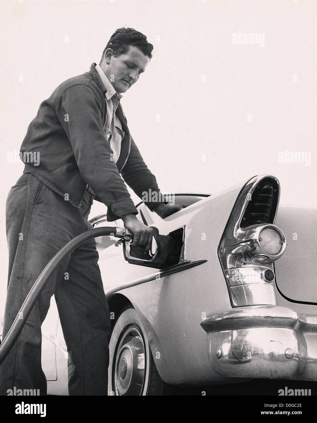 Man pumping gas to his Buick Stock Photo