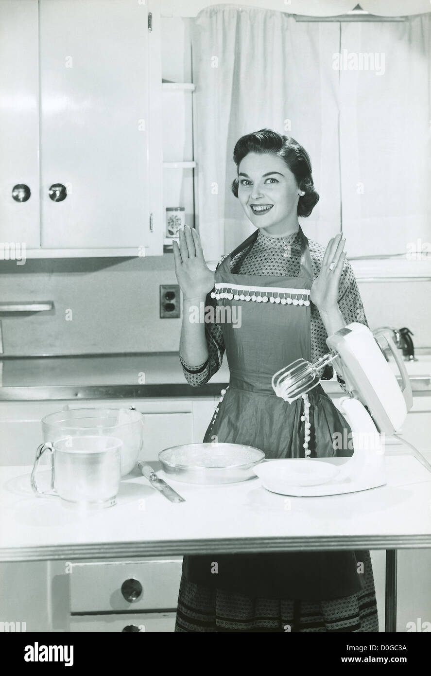 Black and white vintage print of a woman in the kitchen Stock Photo