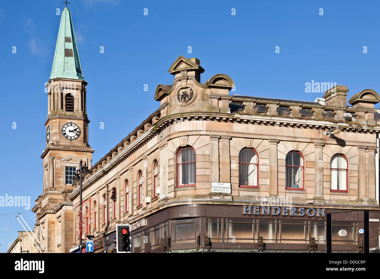 One corner of New Cross, Airdrie, Scotland, UK. Townhouse steeple and Gaelic street name Sraid a'Ghreumaidh (Graham Street) Stock Photo