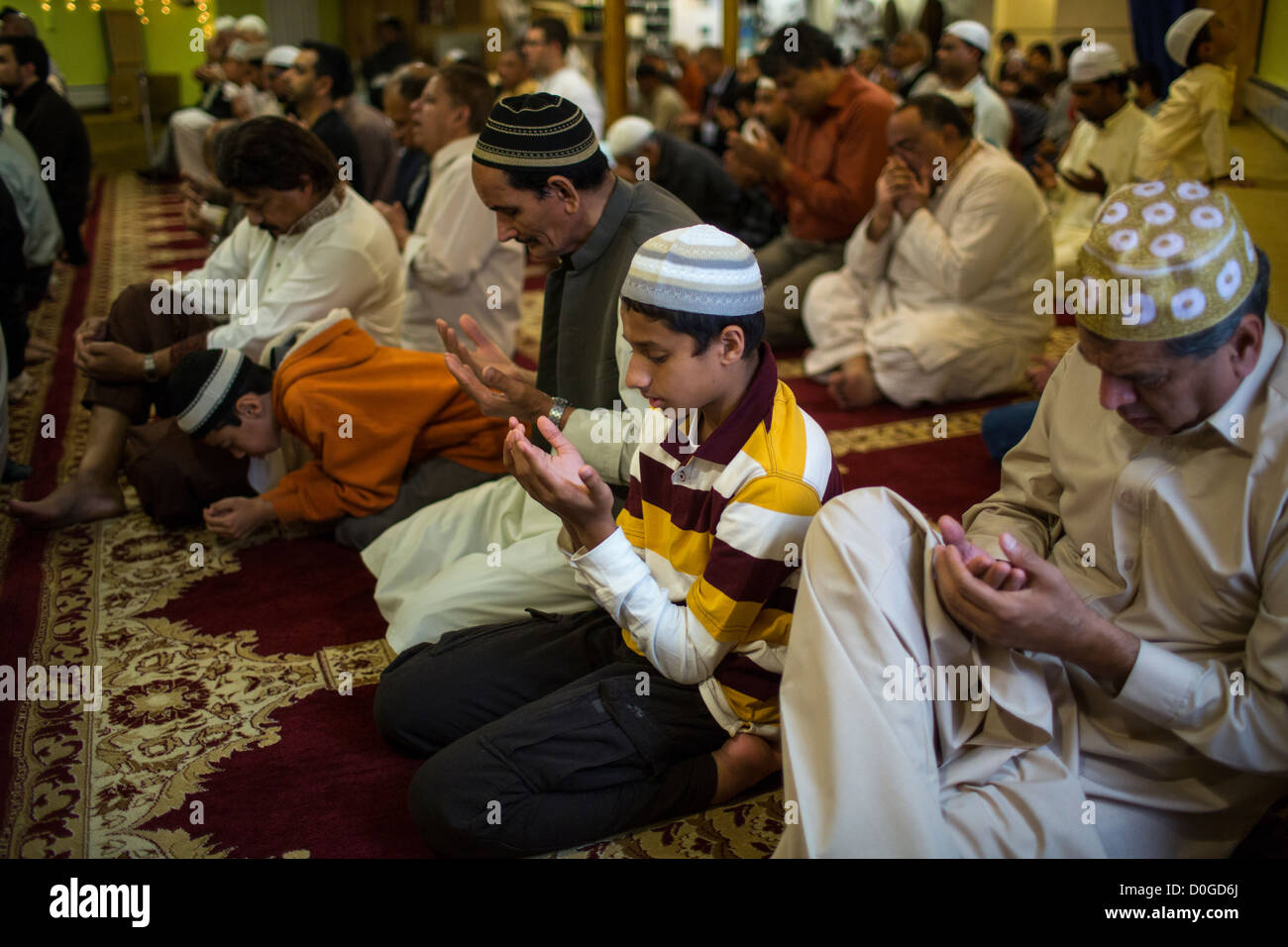 MuslimAmerican men pray at the annual Eid alAdha prayer at a mosque