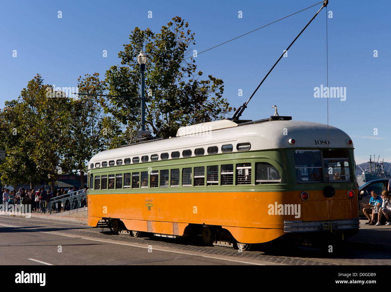 A vintage trolley car transports passengers to San Francisco's Fisherman's Wharf Stock Photo