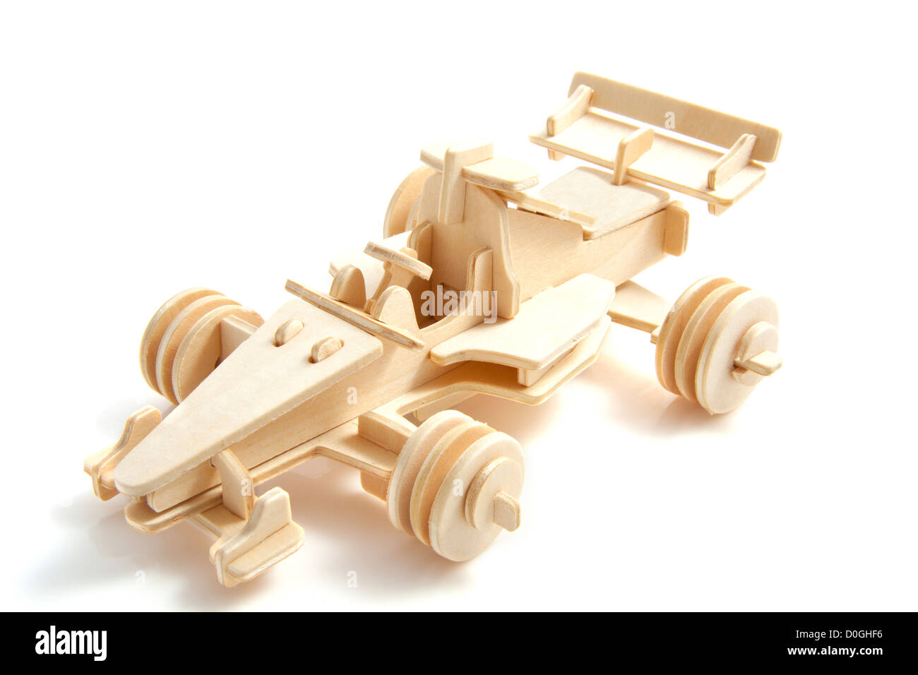 Wooden race car isolated on a white background Stock Photo - Alamy