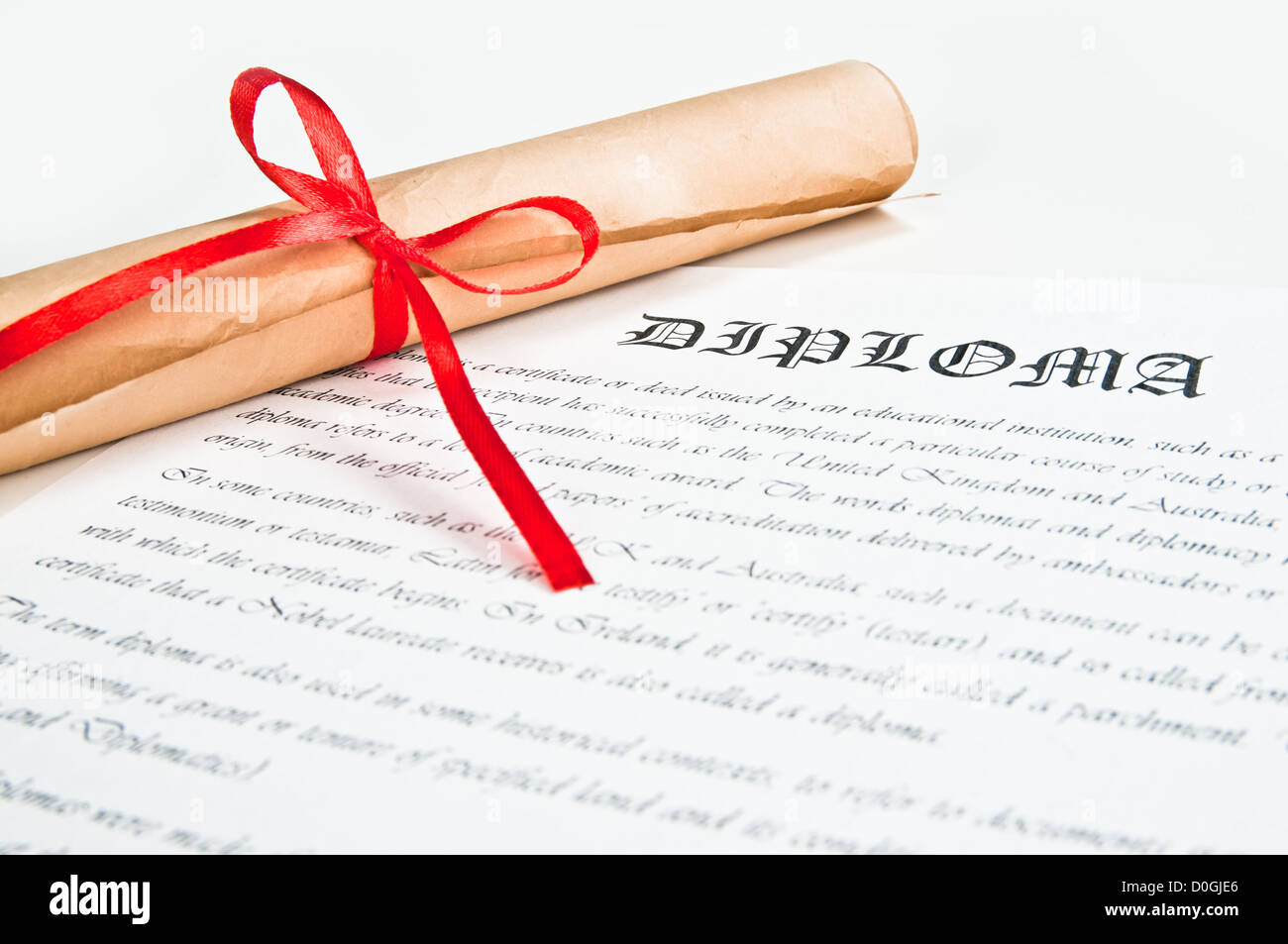 Diploma with red ribbon Stock Photo - Alamy