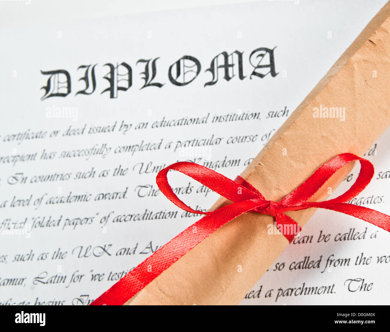 Diploma with red ribbon Stock Photo - Alamy