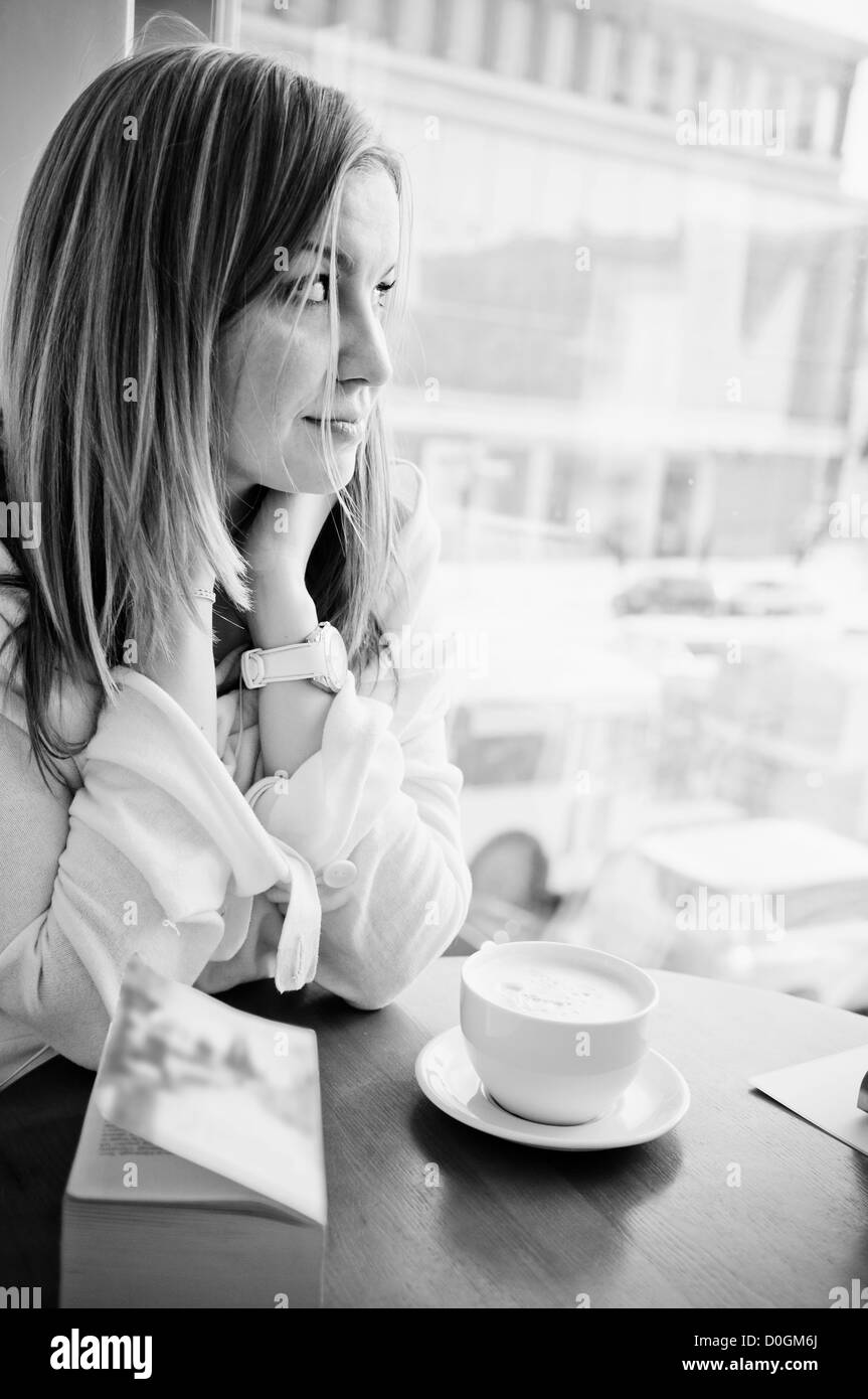 Young beautiful girl in cafe Stock Photo