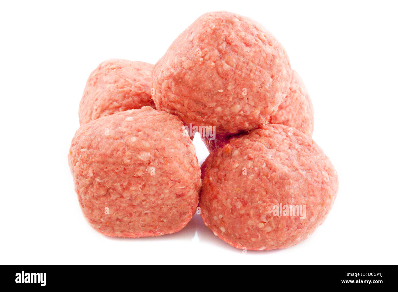 Pile of big raw meat balls isolated over white Stock Photo