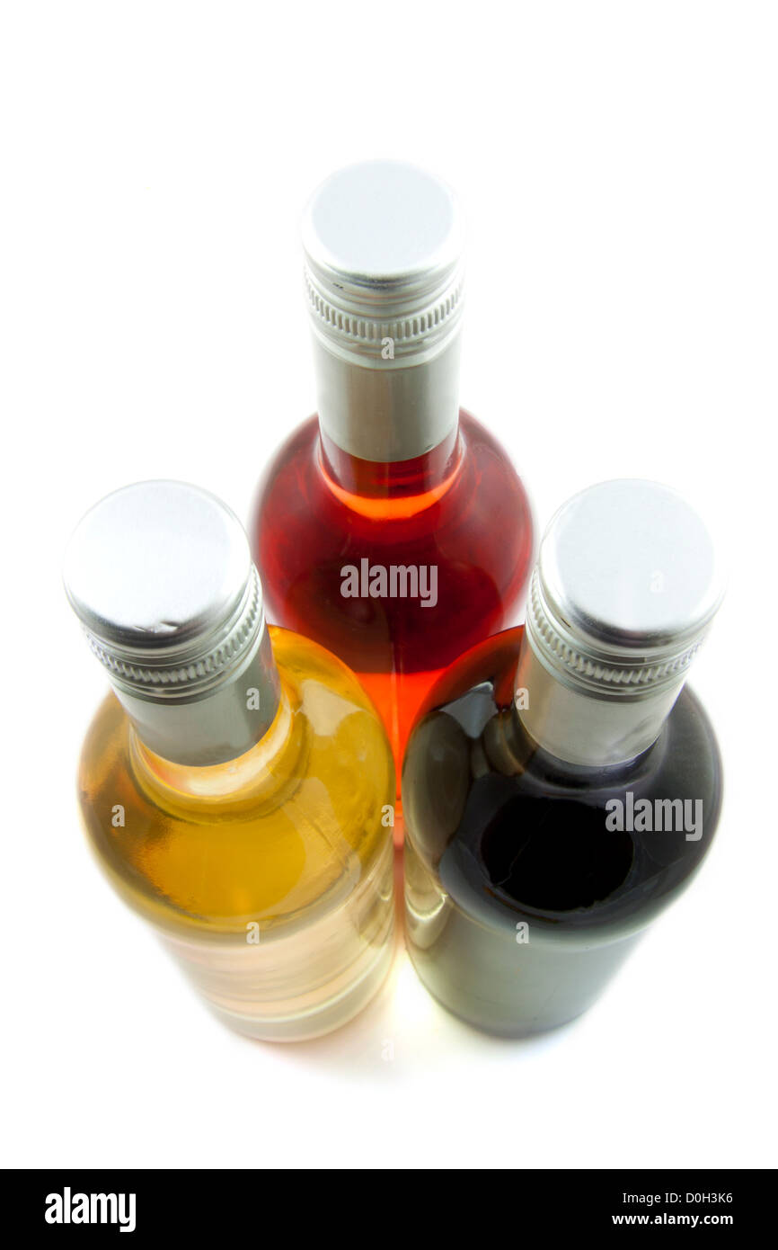 Three bottles of wine isolated over white Stock Photo