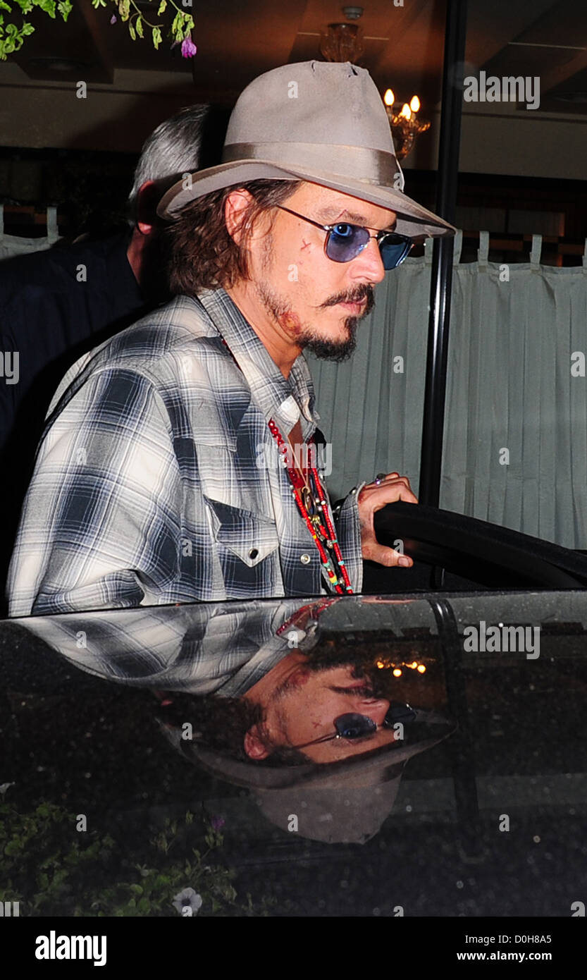 Johnny Depp wearing fedora hat and sunglasses leaves C London restaurant  with cuts and bruises on his face London, England Stock Photo - Alamy