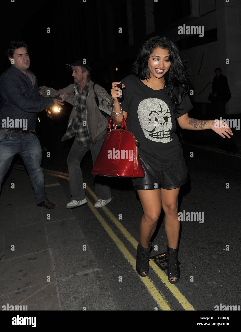 Vanessa White of the girl group The Saturdays spends a day shopping on  Robertson Blvd. Wearing a t-shirt dress with a quote from Audrey Hepburn  that reads, I never think of myself