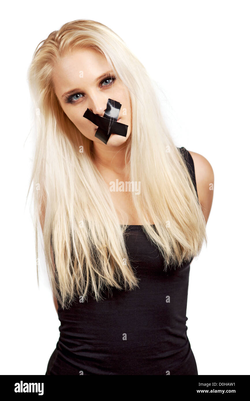 Voiceless woman with a duct tape over her mouth in a struggle for her  freedom of expression Stock Photo - Alamy