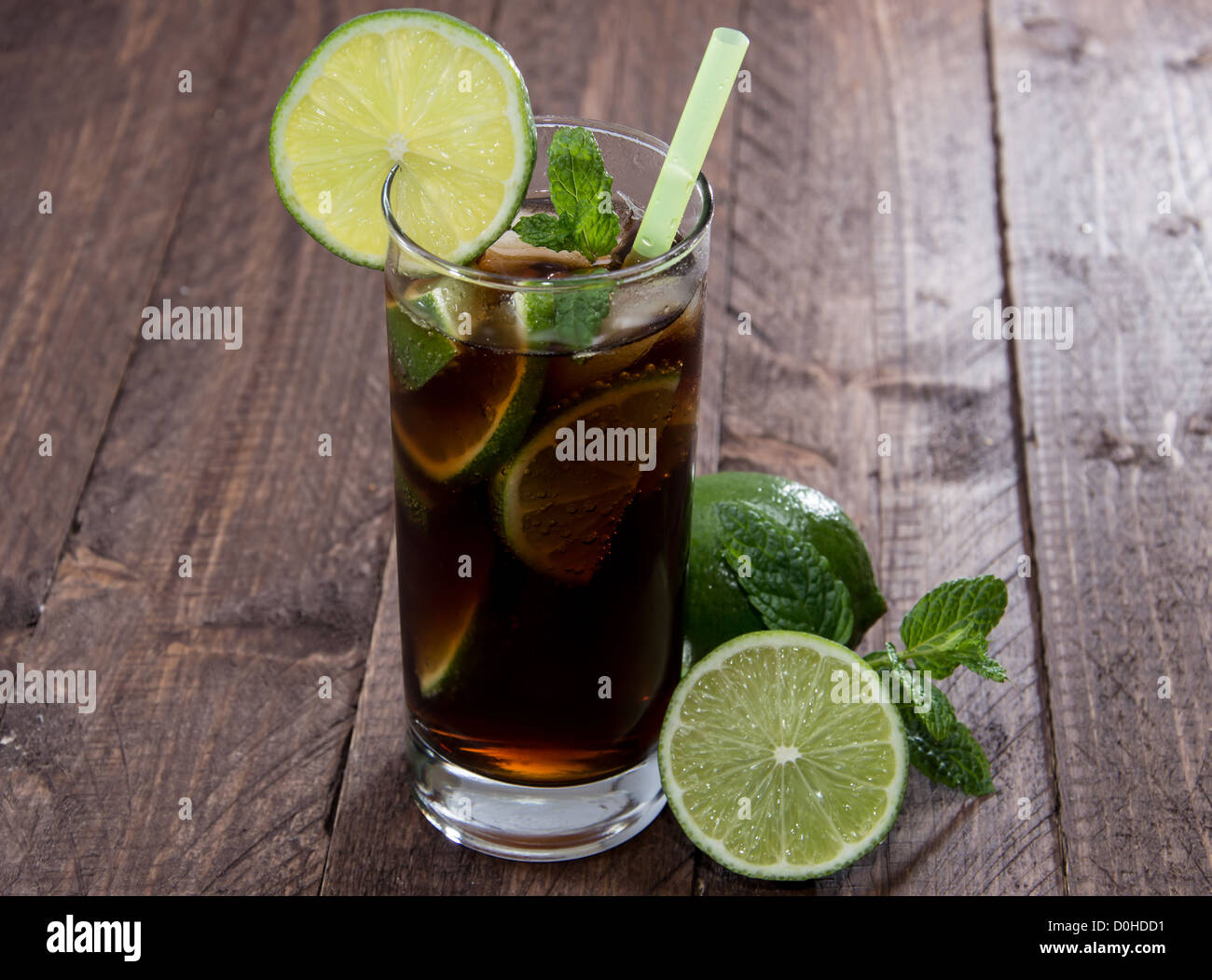 Cola and Rum on wooden background Stock Photo