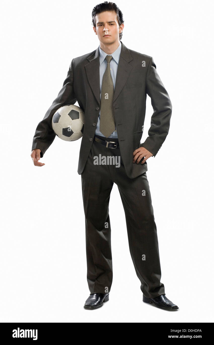 Portrait of a businessman holding a soccer ball Stock Photo - Alamy