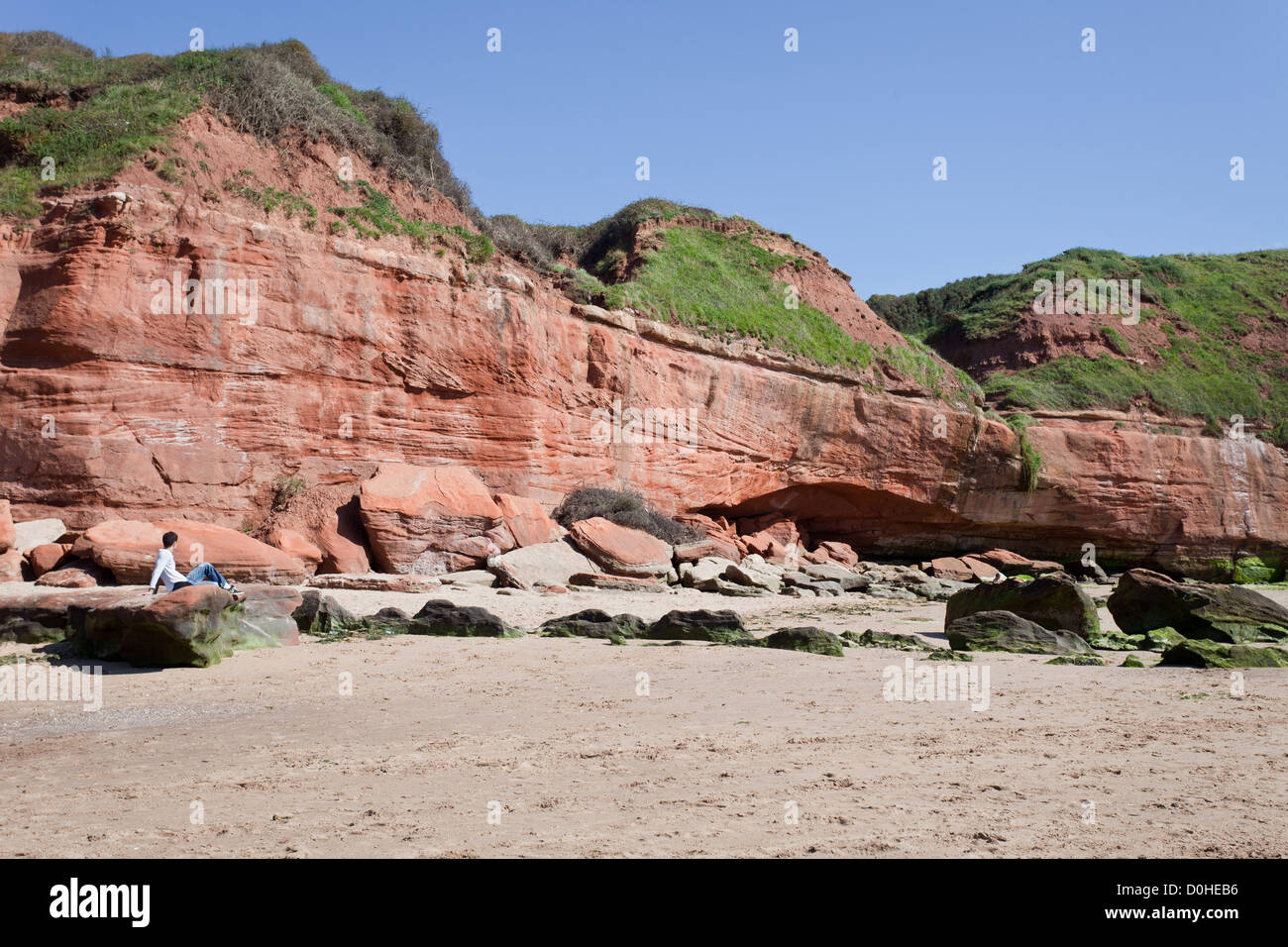 Jurassic Coast, UK - September 13, 2012: Caucasian young man enjoying The Jurassic Coast near Exmouth Stock Photo