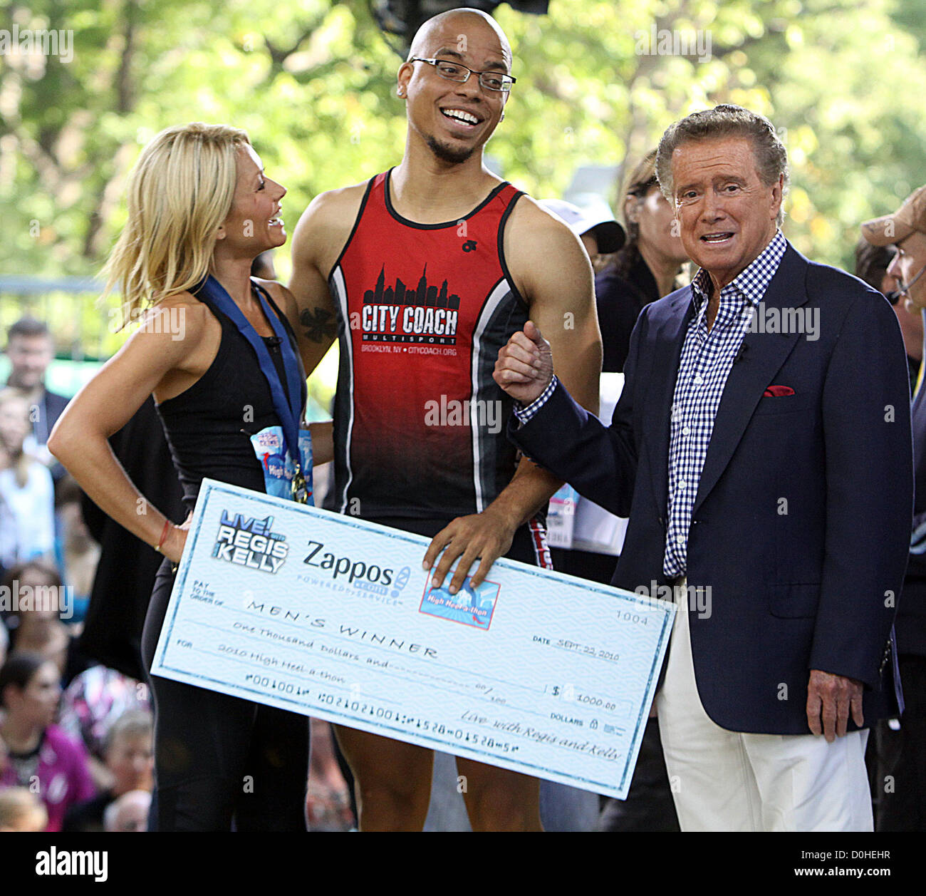 Kelly Ripa, Regis Philbin, and the winner Shane Neil for the male run of Live with Regis and Kelly High Heel-A-Thon Race 2010 Stock Photo