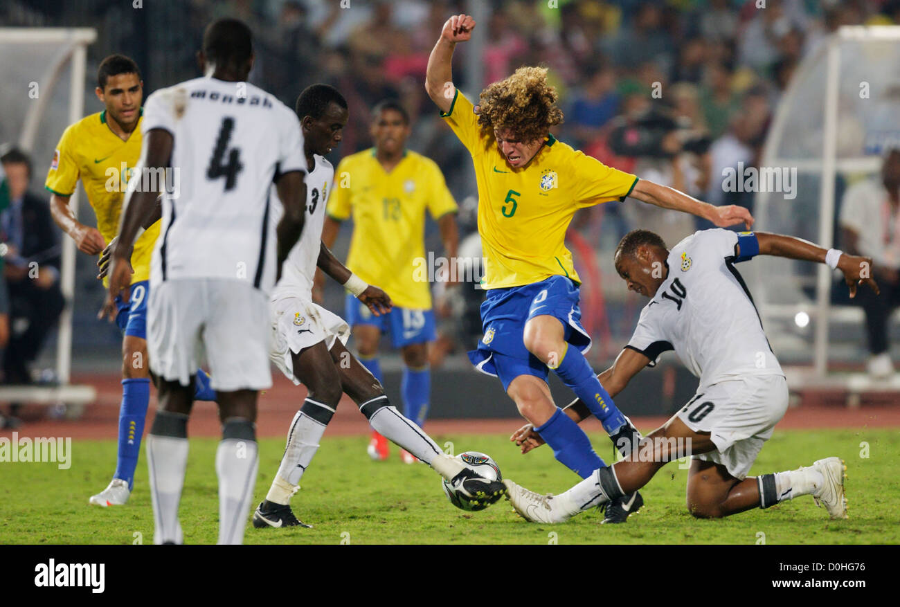 Renan of Brazil (5) fights against Ghana defenders during the 2009 FIFA U-20 World Cup final at Cairo International Stadium. Stock Photo