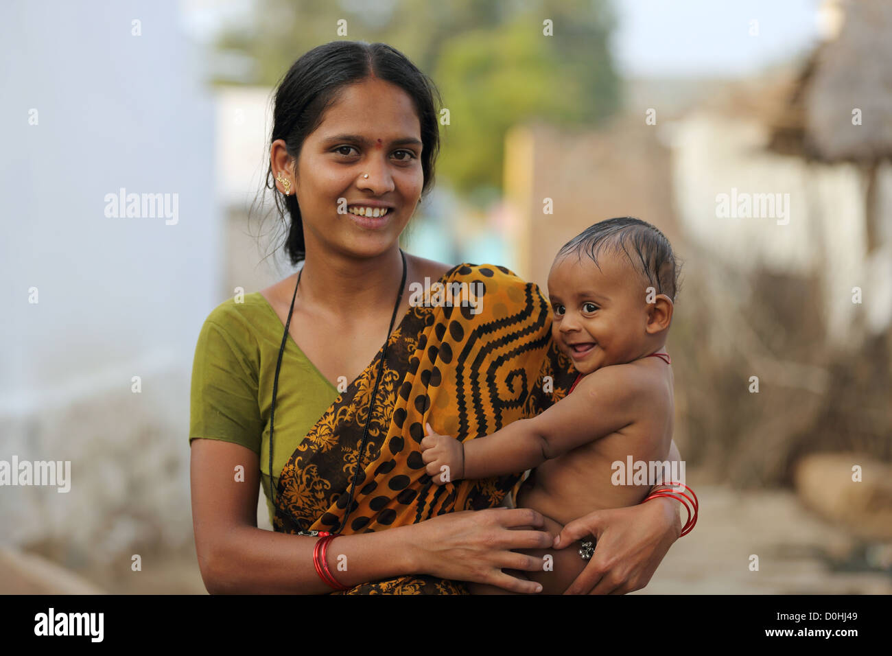 Indian mother holding her baby son Andhra Pradesh South India ...