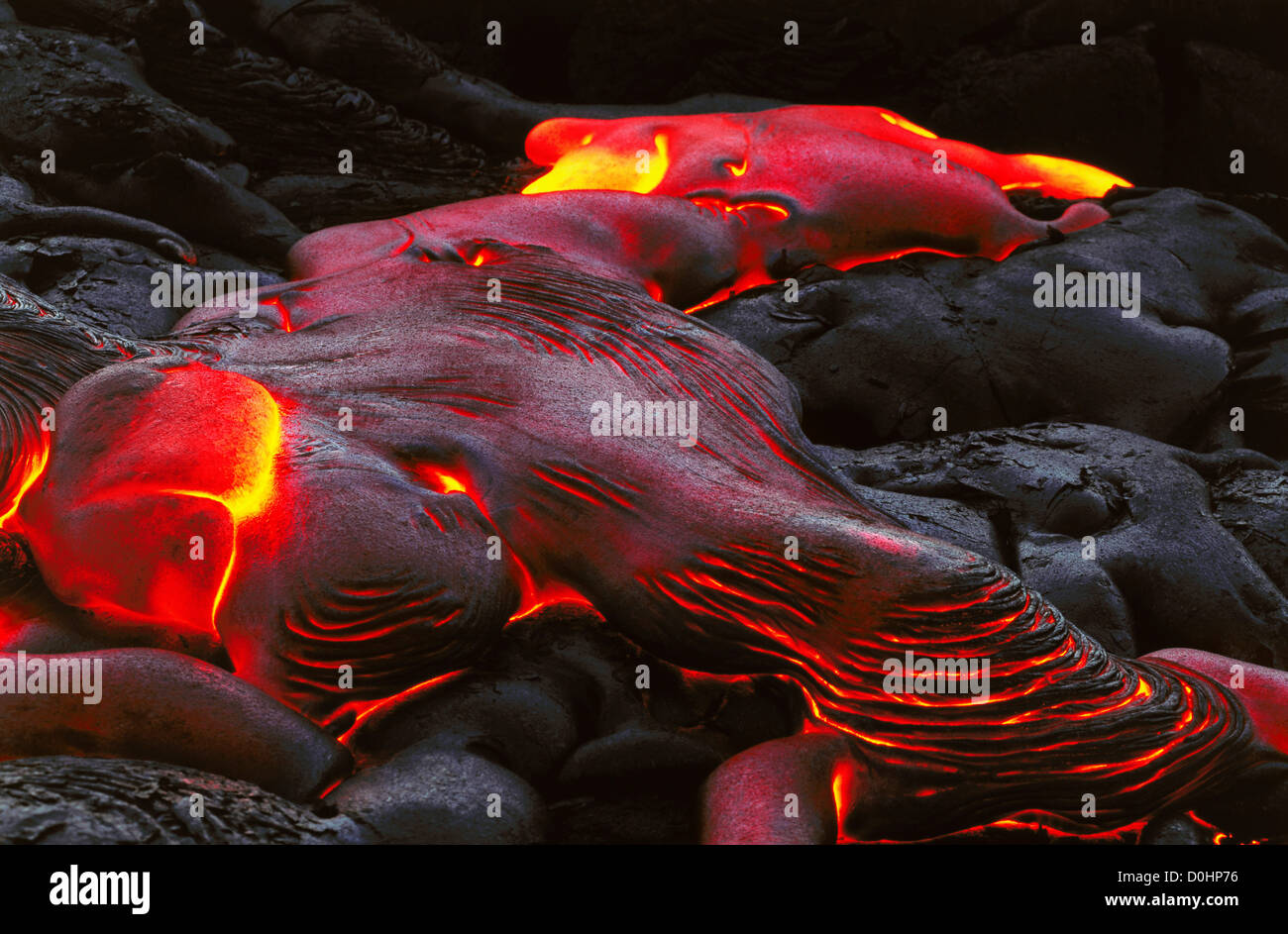 Slow Moving Glowing Hot Pahoehoe Begins to Cool Stock Photo