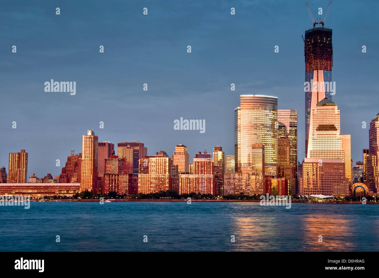 Downtown Manhattan skyline with Freedom tower at sunset, view from Jersey City - New York City, USA Stock Photo