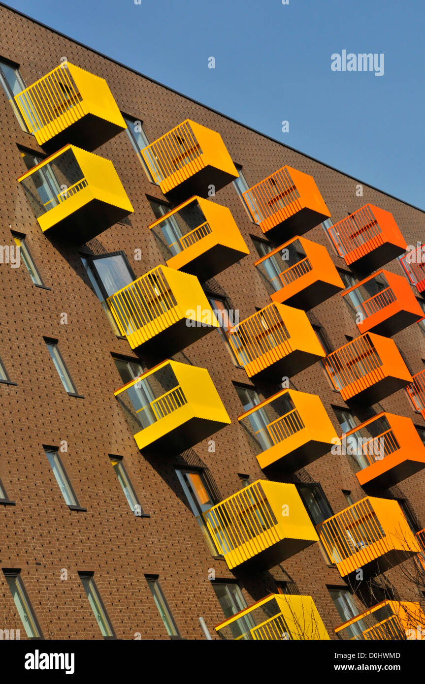 Bright colourful building materials on apartment block balconies 