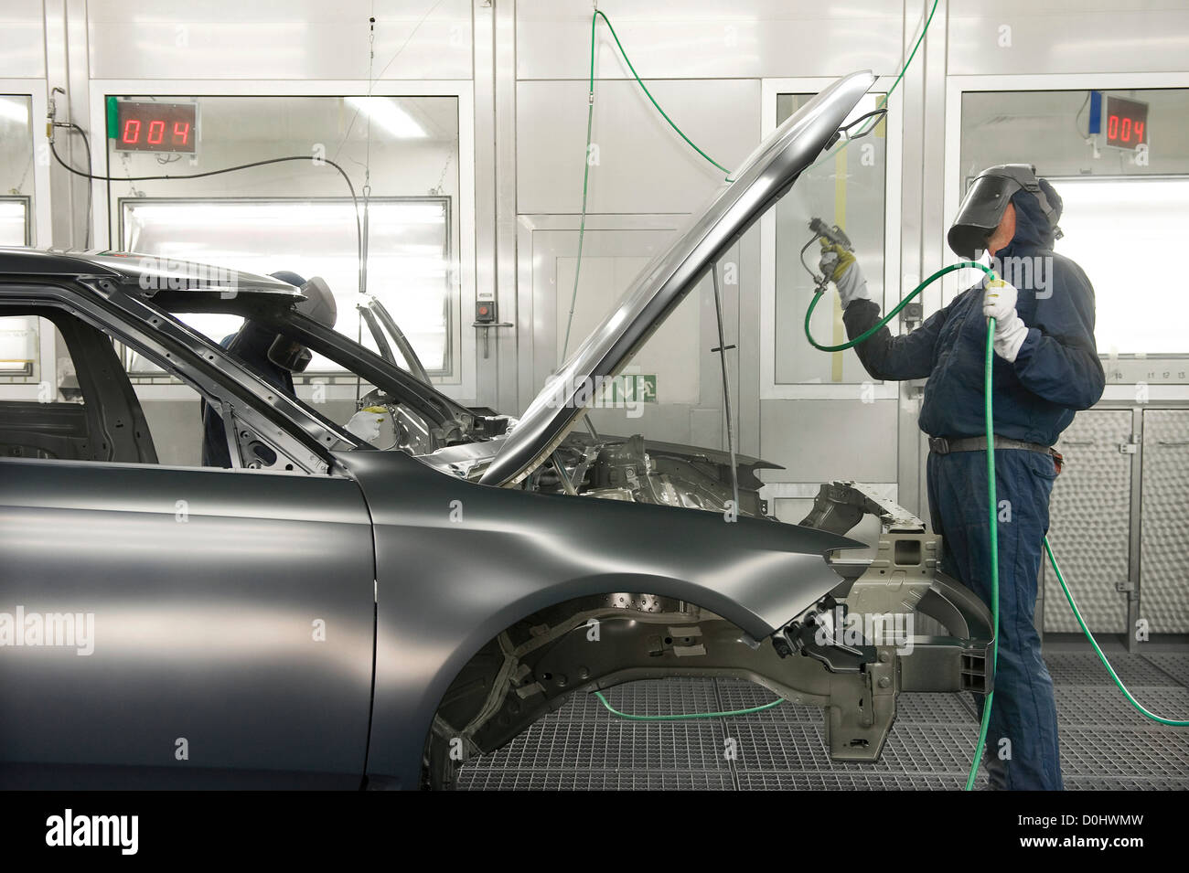 paint sprayer in car factory Stock Photo Alamy