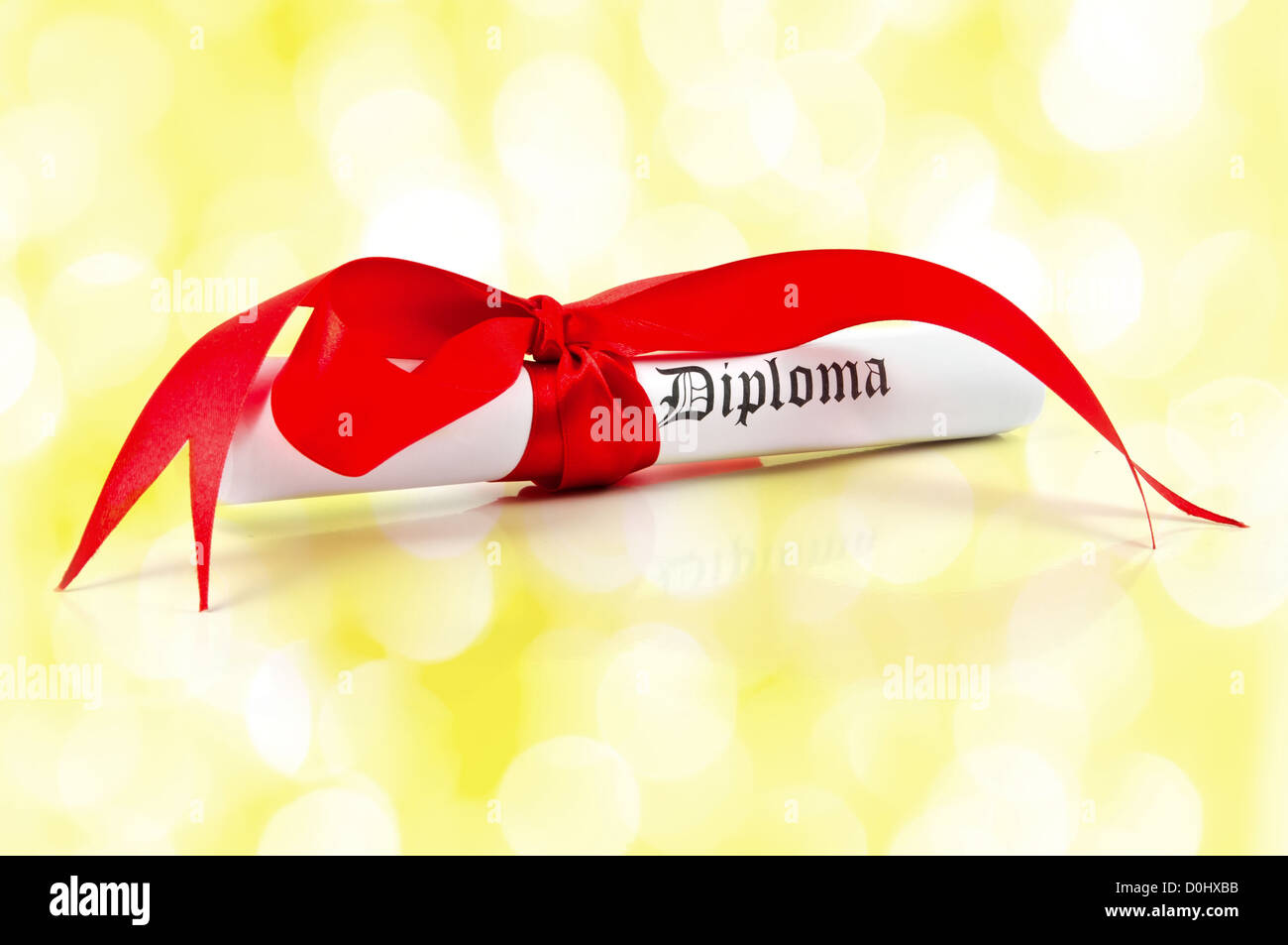 Diploma with red ribbon Stock Photo - Alamy
