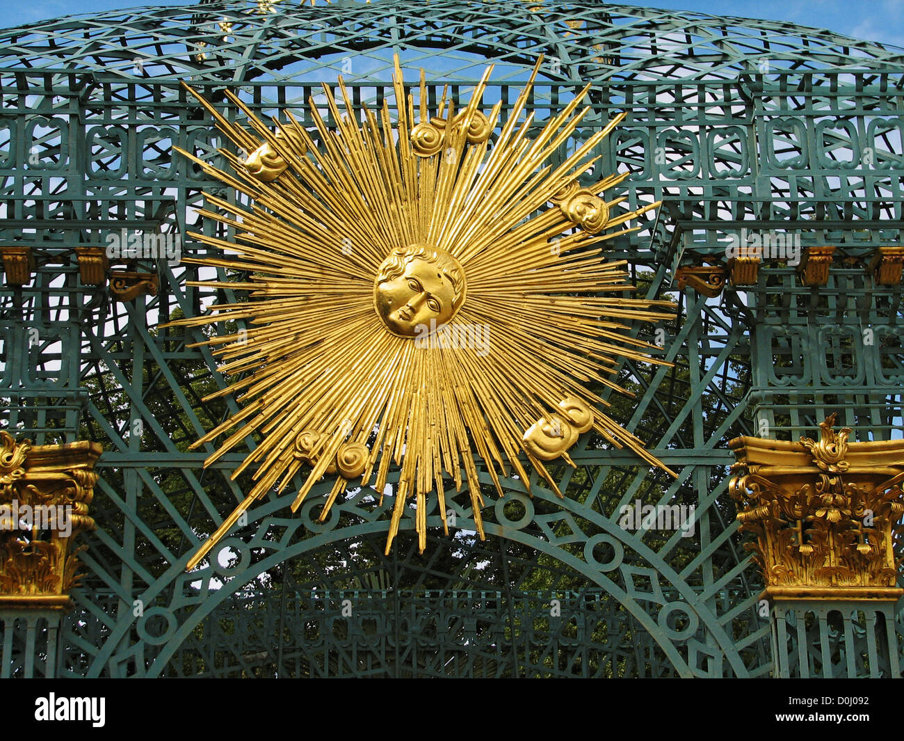 A golden sun symbol on trellised gazebo in gardens Sanssouci Palace summer residence Frederick Great in Potsdam Germany Stock Photo