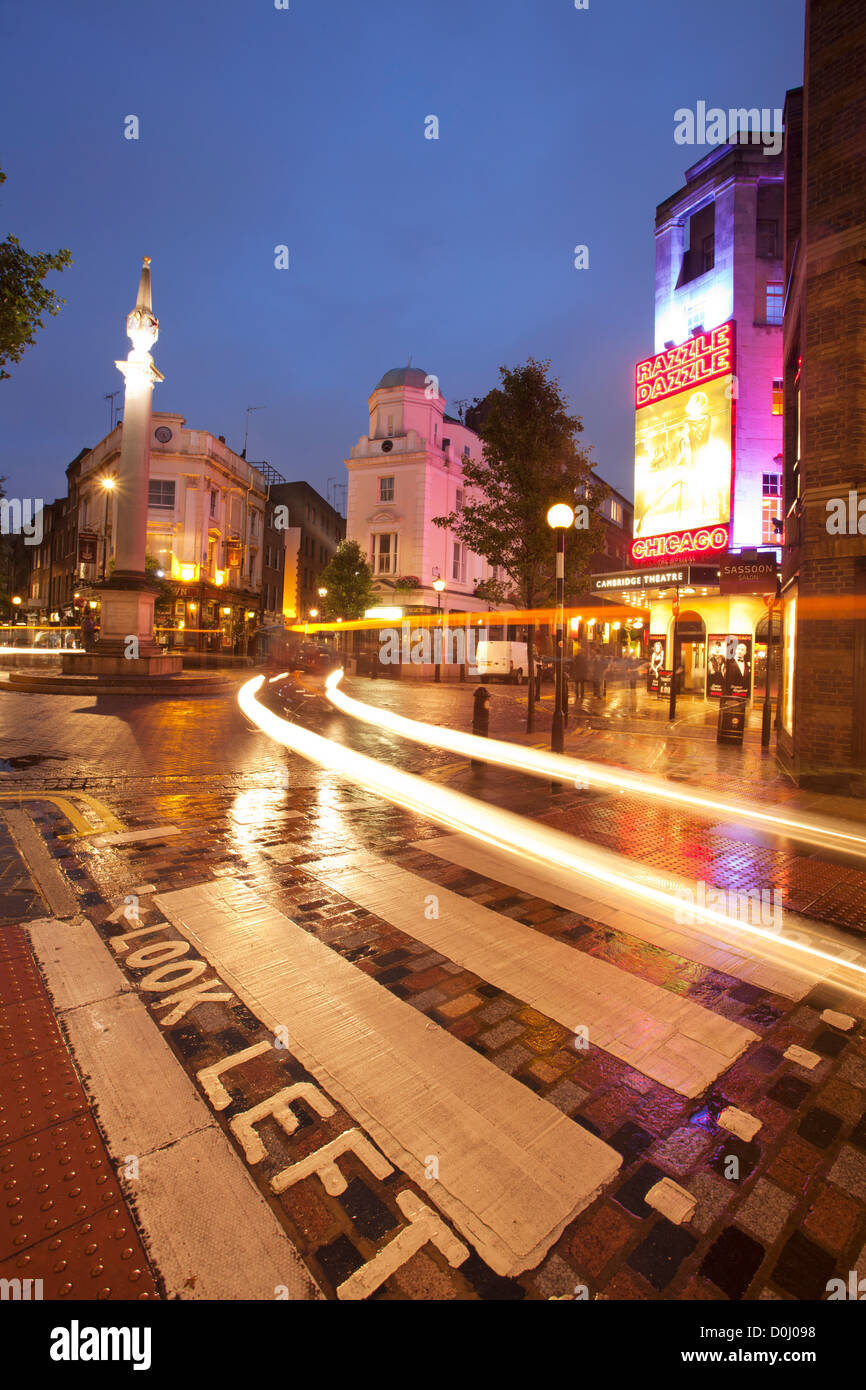 A view of seven dials junction with light trails near the Cambridge Theatre. Stock Photo