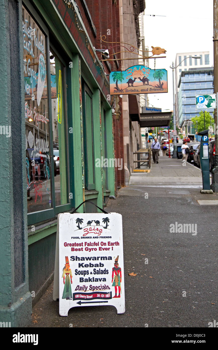 Downtown Seattle sidewalk in Pioneer Square, Zaina Middle Eastern food restaurant sidewalk sign Stock Photo