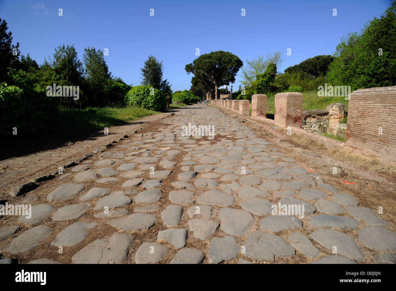 italy, rome, ostia antica, decumanus maximus, ancient roman road Stock Photo