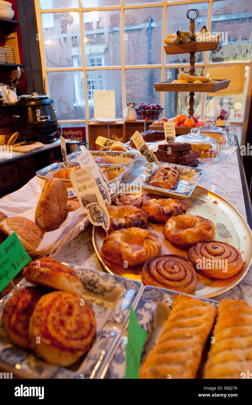 Traditional English cakes and savouries on display in the Apothecary cafe in Rye. Stock Photo