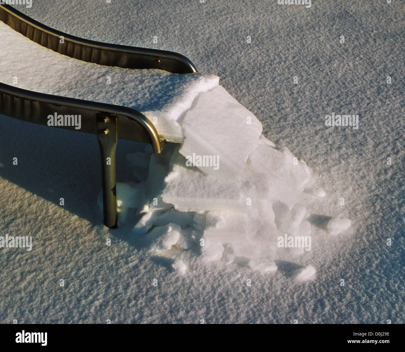 Snow Slides Down a Slide Stock Photo