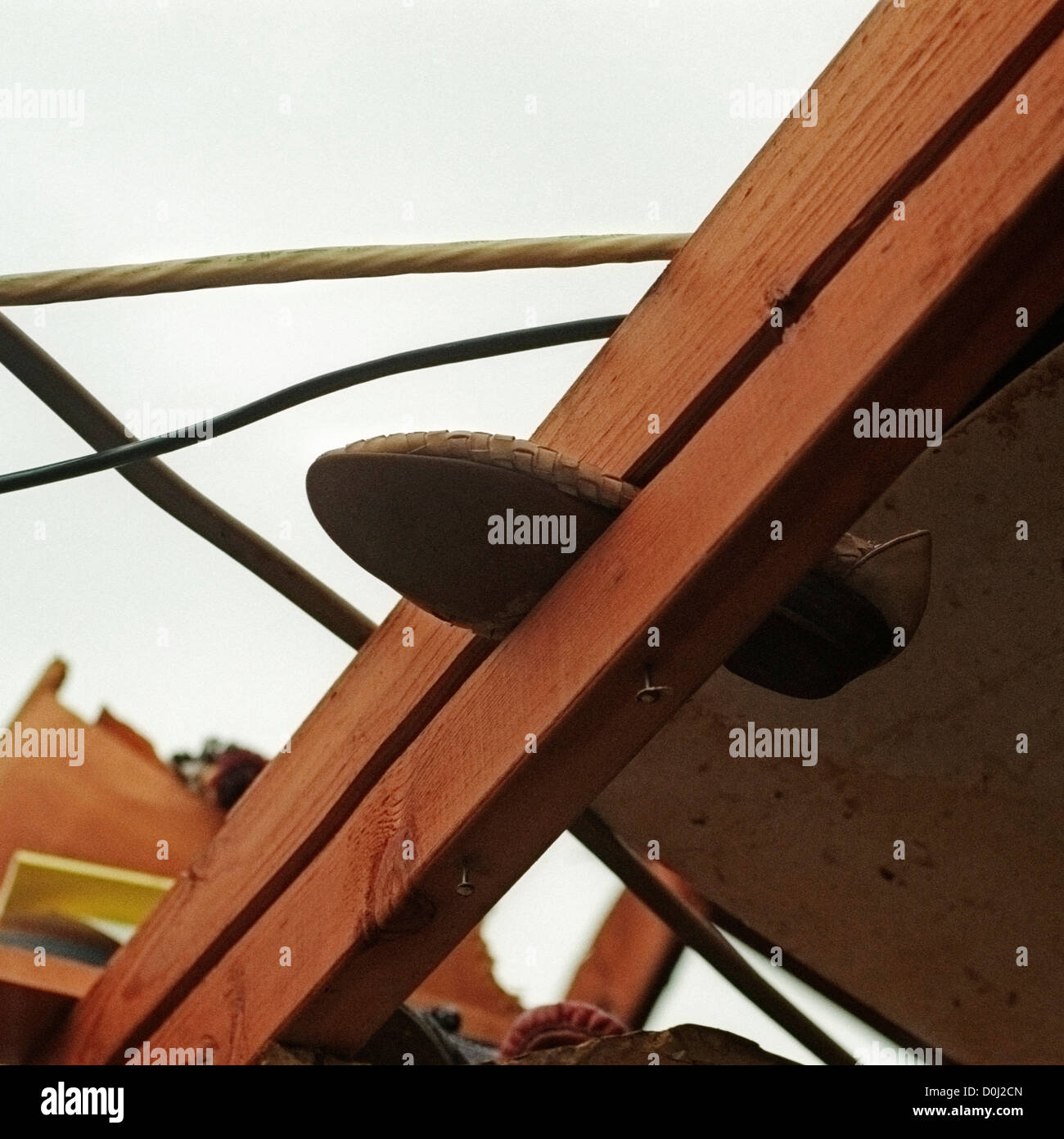 Shoe Impaled Through Wood Stock Photo