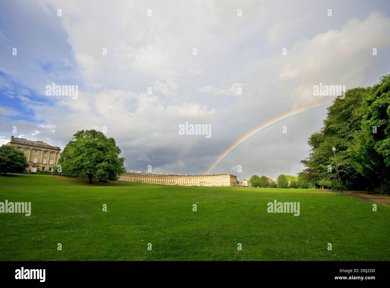 A view of the Royal Crescent in Bath with a rainbow overhead. Stock Photo